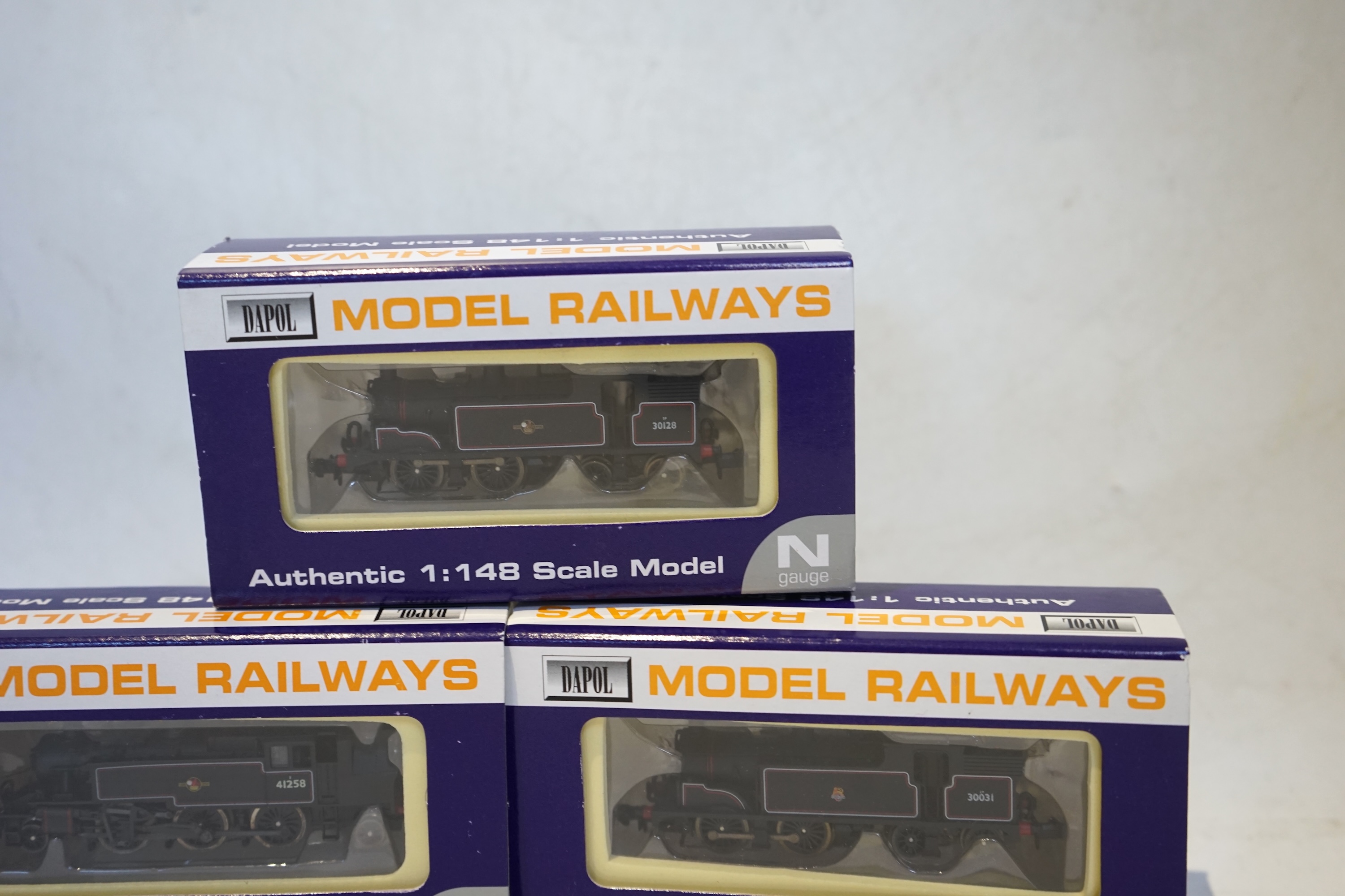 Three boxed Dapol N gauge railway BR tank locomotives; an Ivatt 2-6-2T, 41258 (ND-061B), a Class M7, 30128 (ND-045), and a Class M7, 30031 (ND-025). Condition - good.